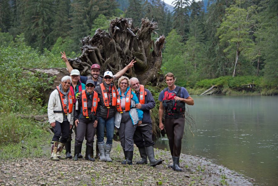 A Bluewater group poses for a picture before a fallen tree if ==n there adventure gear.