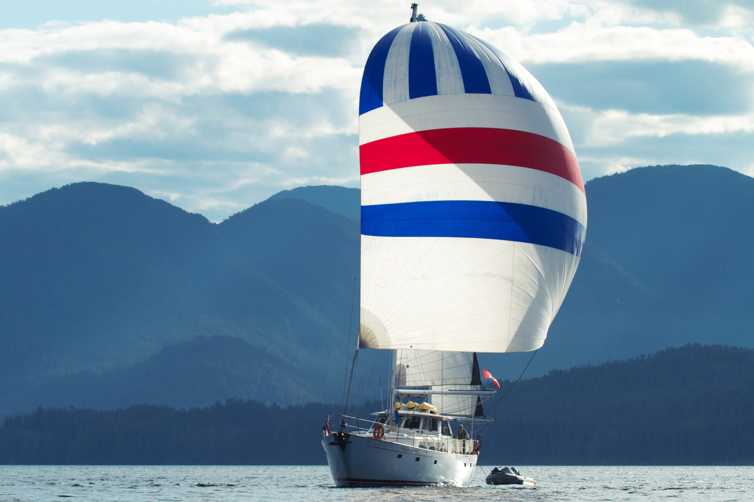 A large sailing yacht with her sails full.