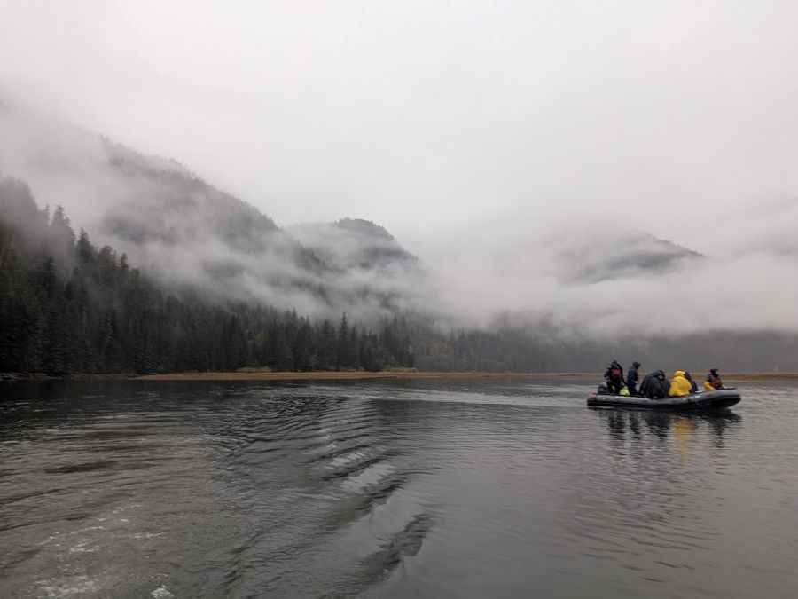 Bluewater Adventures guests aboard a zodiac exploring in the mist.